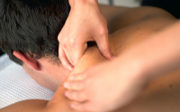 Osteopath treating a shoulder